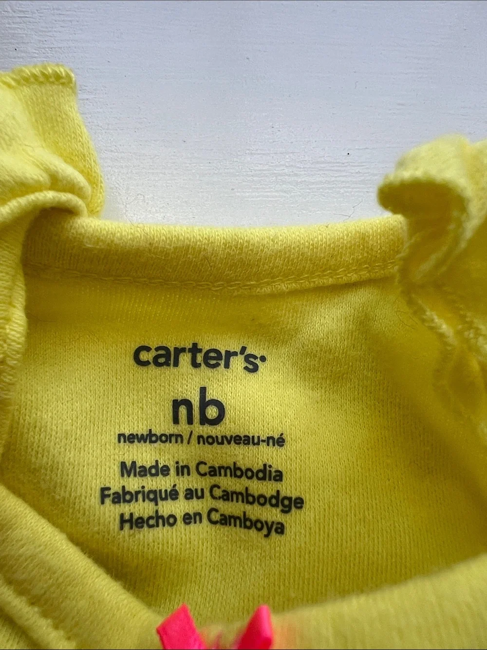 Carter's Yellow Ruffle-Shoulder Newborn Onesie
